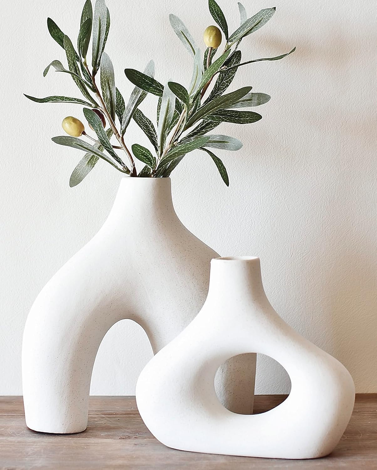 Carrot’s Den Ceramic Modern Vase Set of 2, Donut Shelf Decor, Warm White | Matte pair for bookshelf and bookcase decor, mantel styling, or home staging. Holds dried stems and faux plants indoor.
